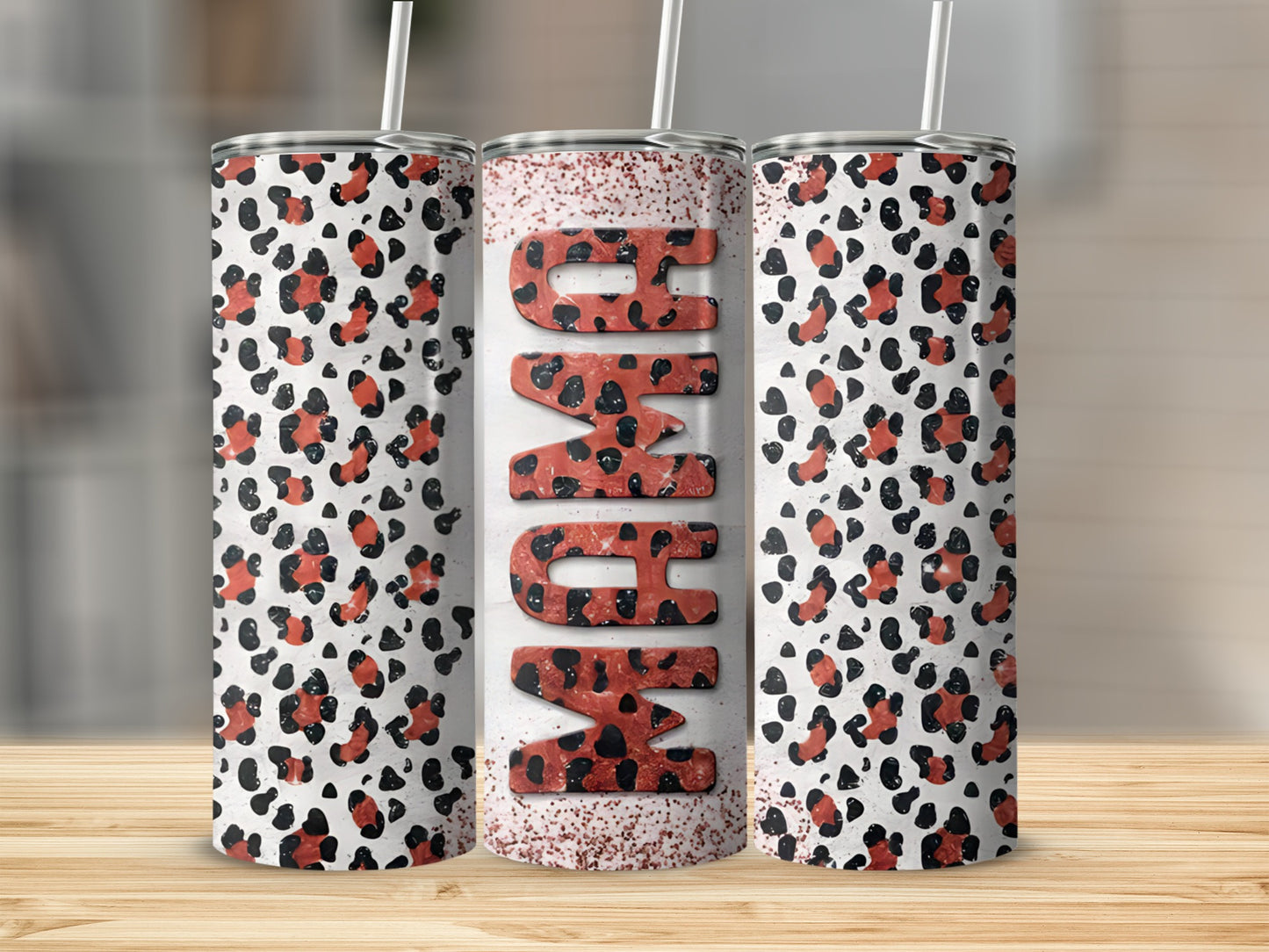 Three tumblers with leopard print and "Mama" text on the middle tumbler.