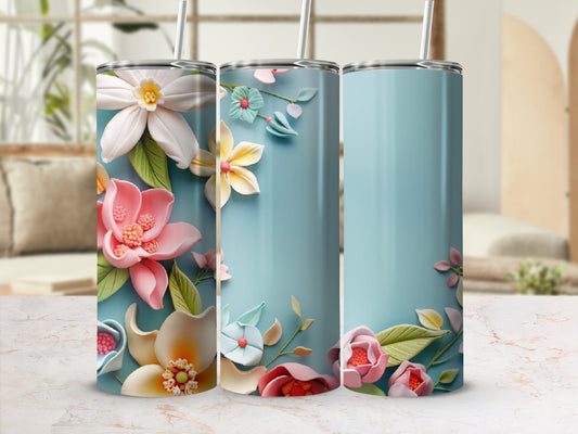 Three pastel tumblers with detailed floral embellishments and straws.