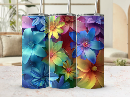 Three tumblers with vibrant floral patterns in blue, yellow, and purple hues.