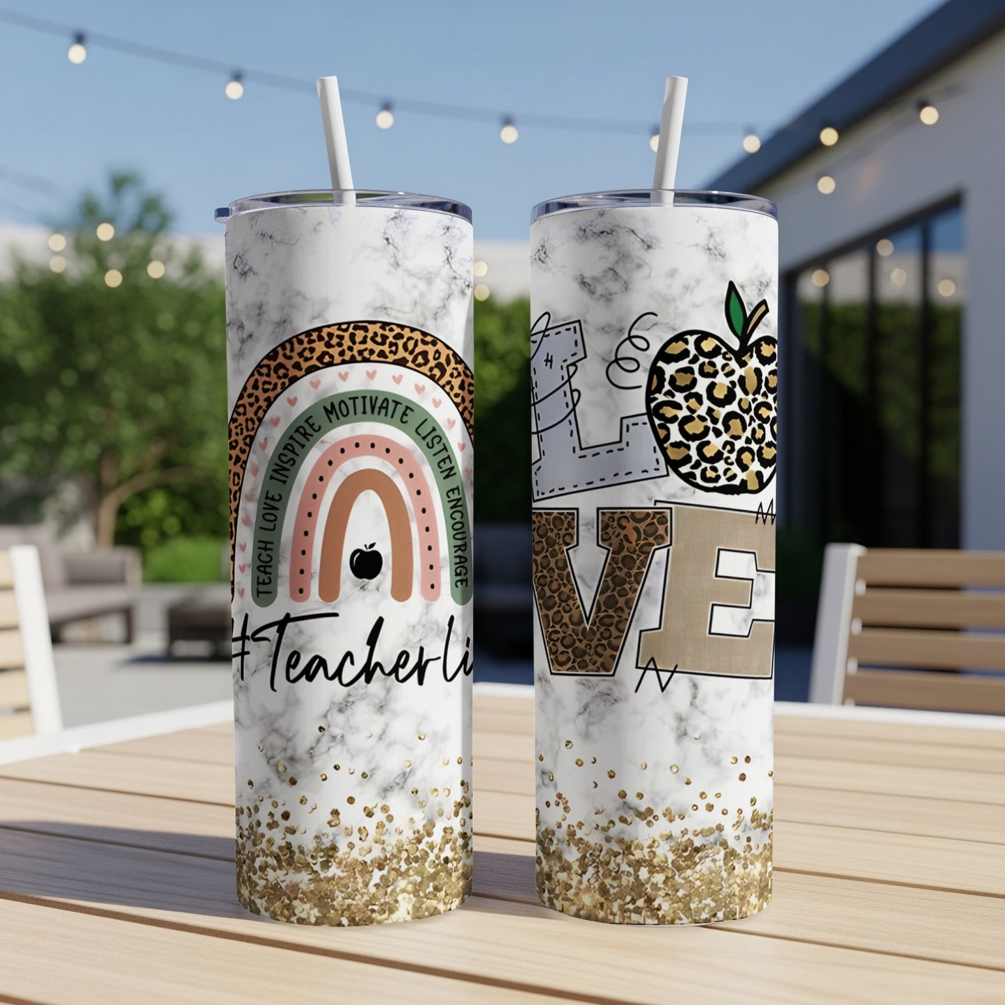 Two skinny tumblers with marble, glitter, and inspirational text and designs.