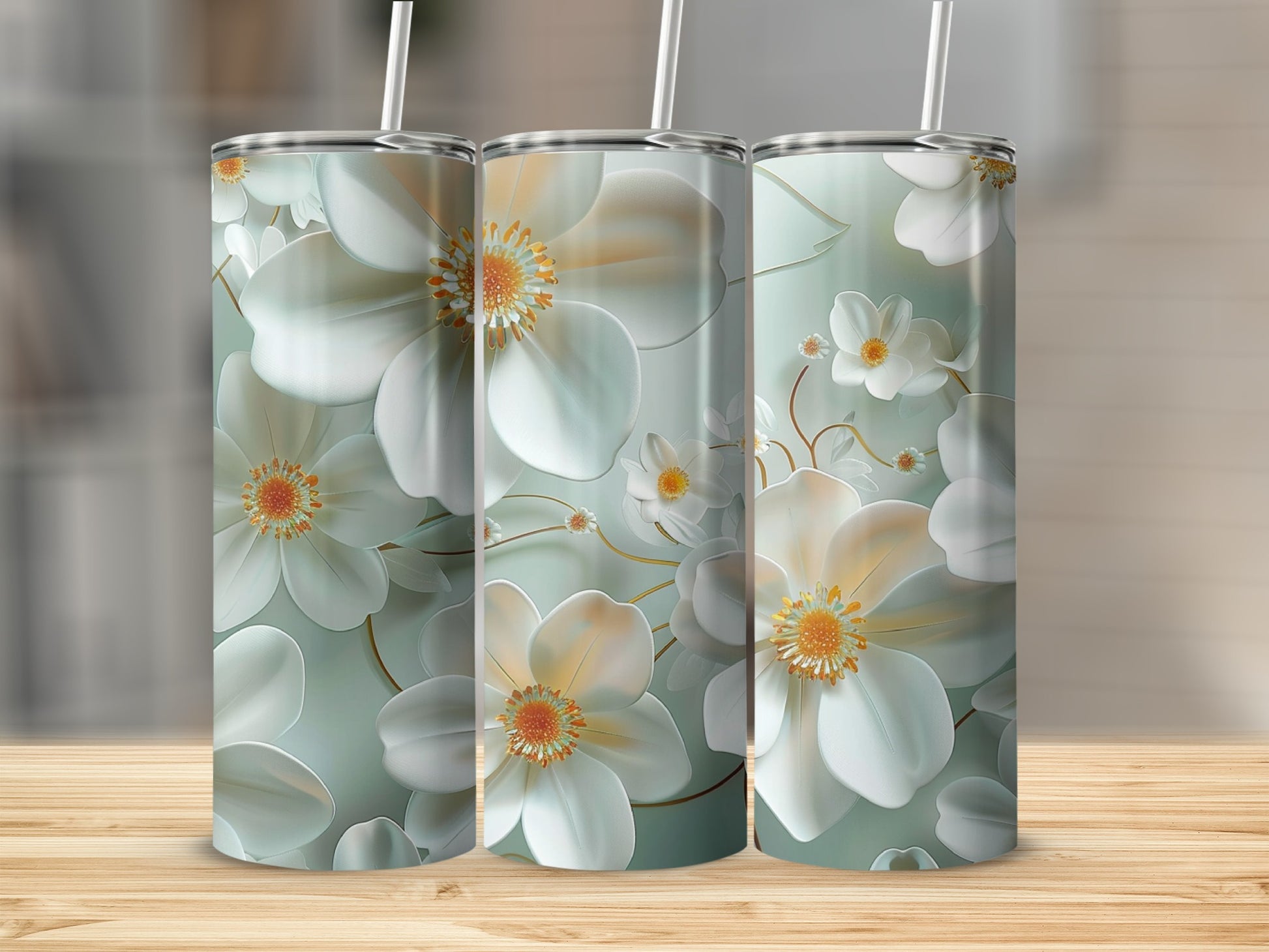 Three tumblers with a white and orange floral pattern.