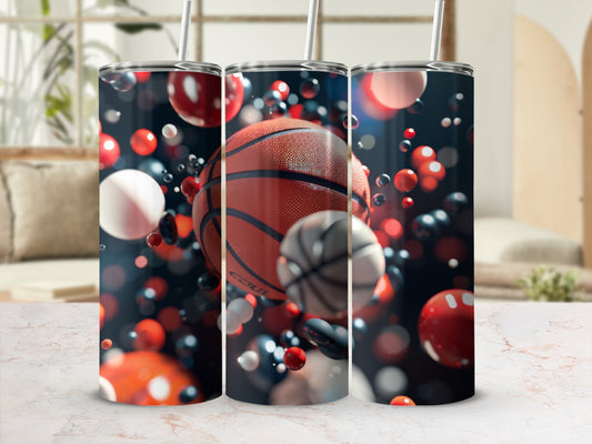Three tumblers with basketballs and abstract bubbles on a marble surface.