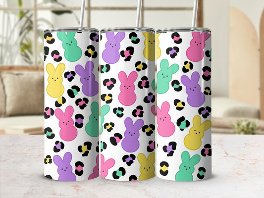Three tumblers with bunny and leopard print patterns, with straws.