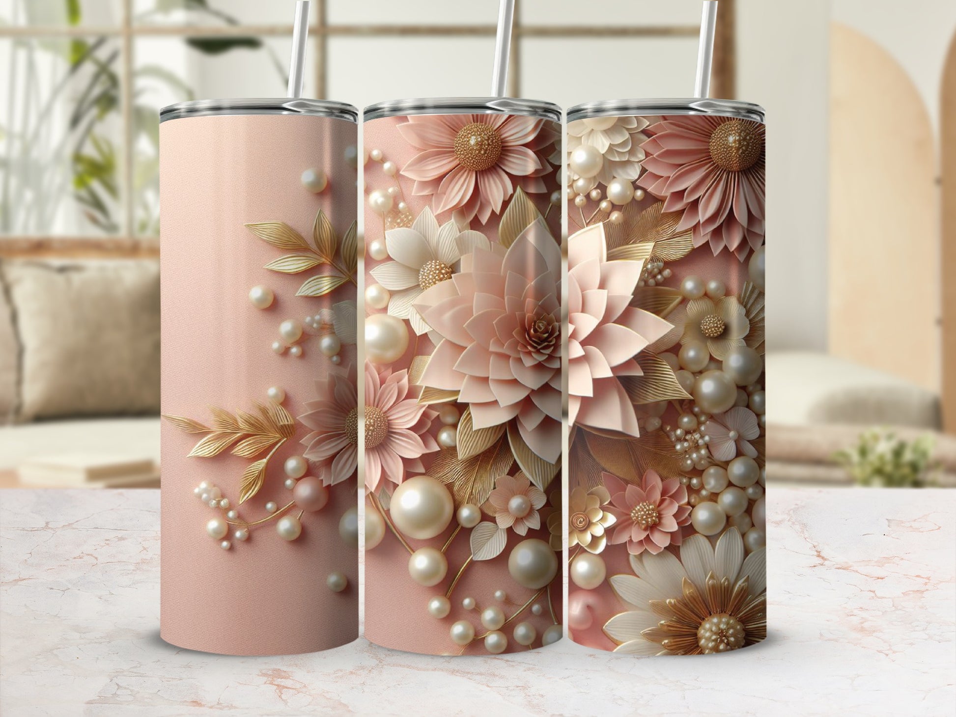 Three blush pink tumblers with floral and pearl embellishments.