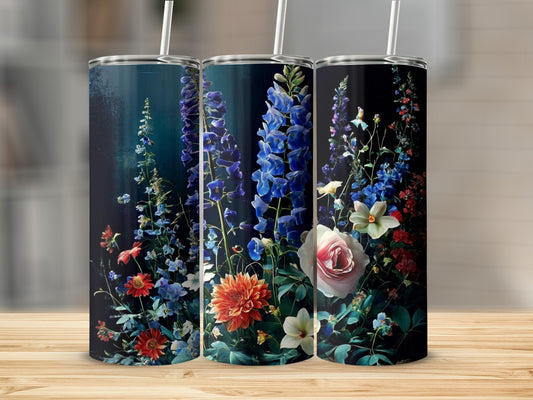 Floral design on three tumblers with dark background and wood grain surface.