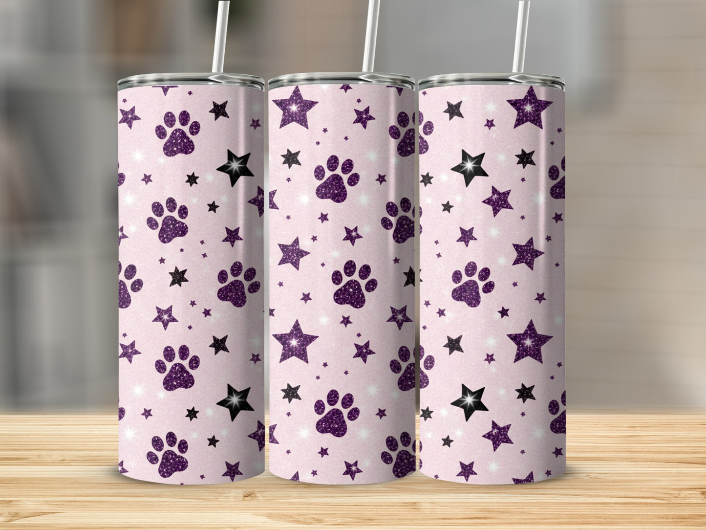 Three purple tumblers with paw prints and stars pattern.