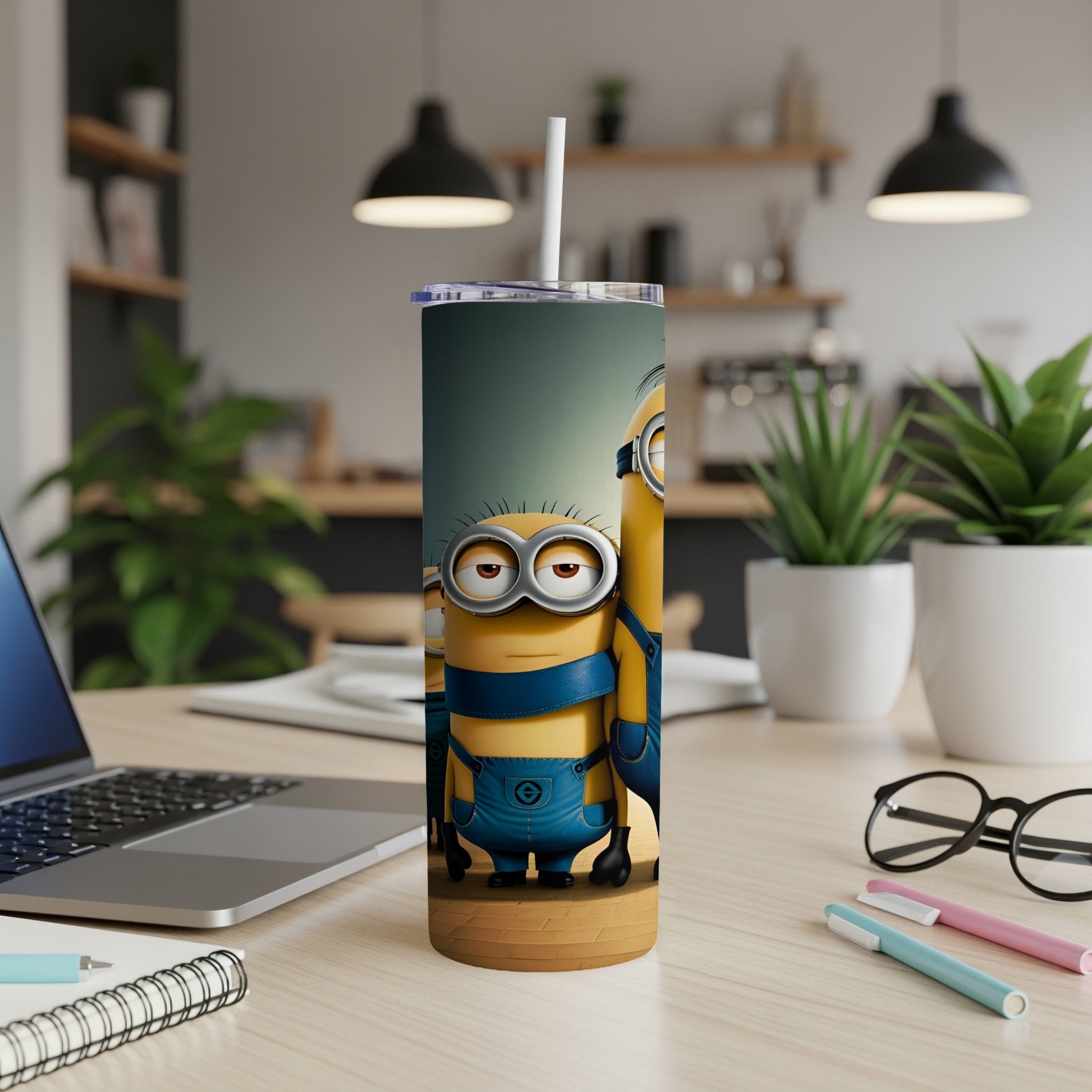 Minions Stuart and Dave on a blue and yellow tumbler with a straw.