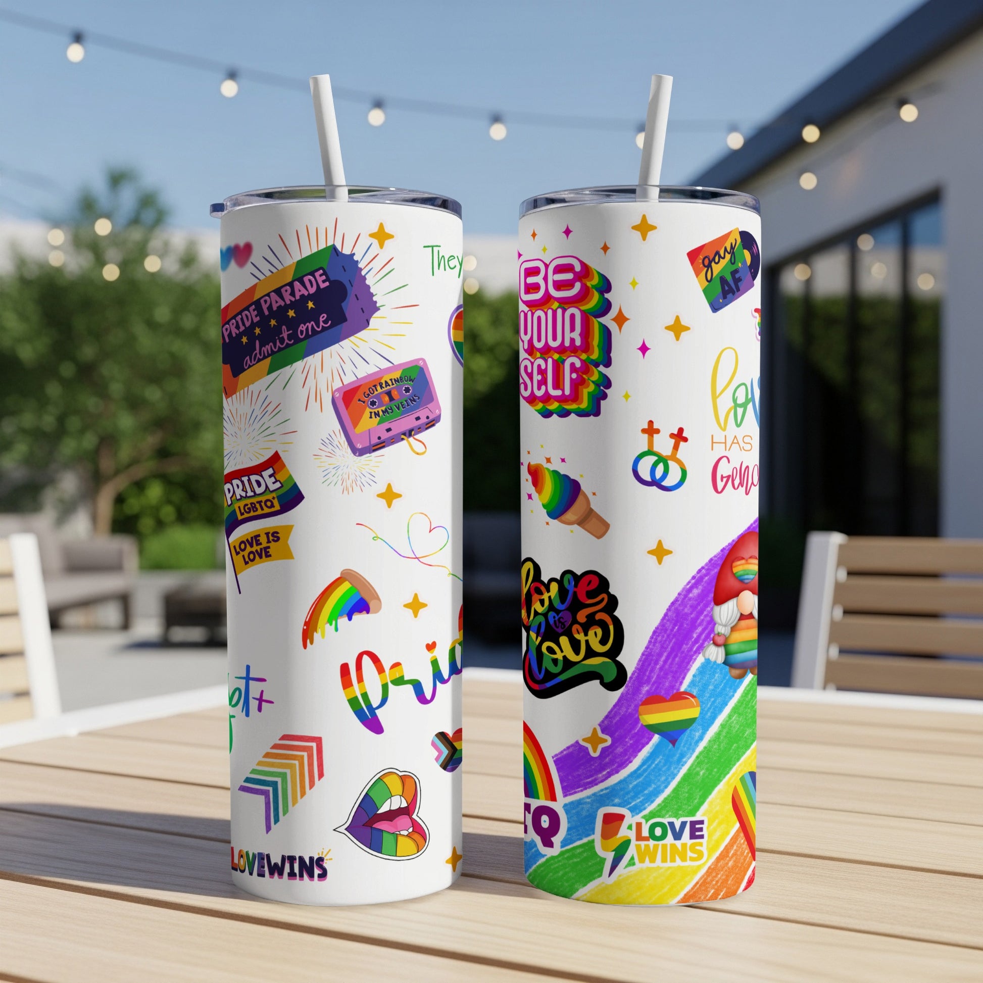 Two tumblers decorated with LGBTQ+ pride symbols and text.