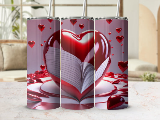 Three tumblers with an open book and heart design on a surface.