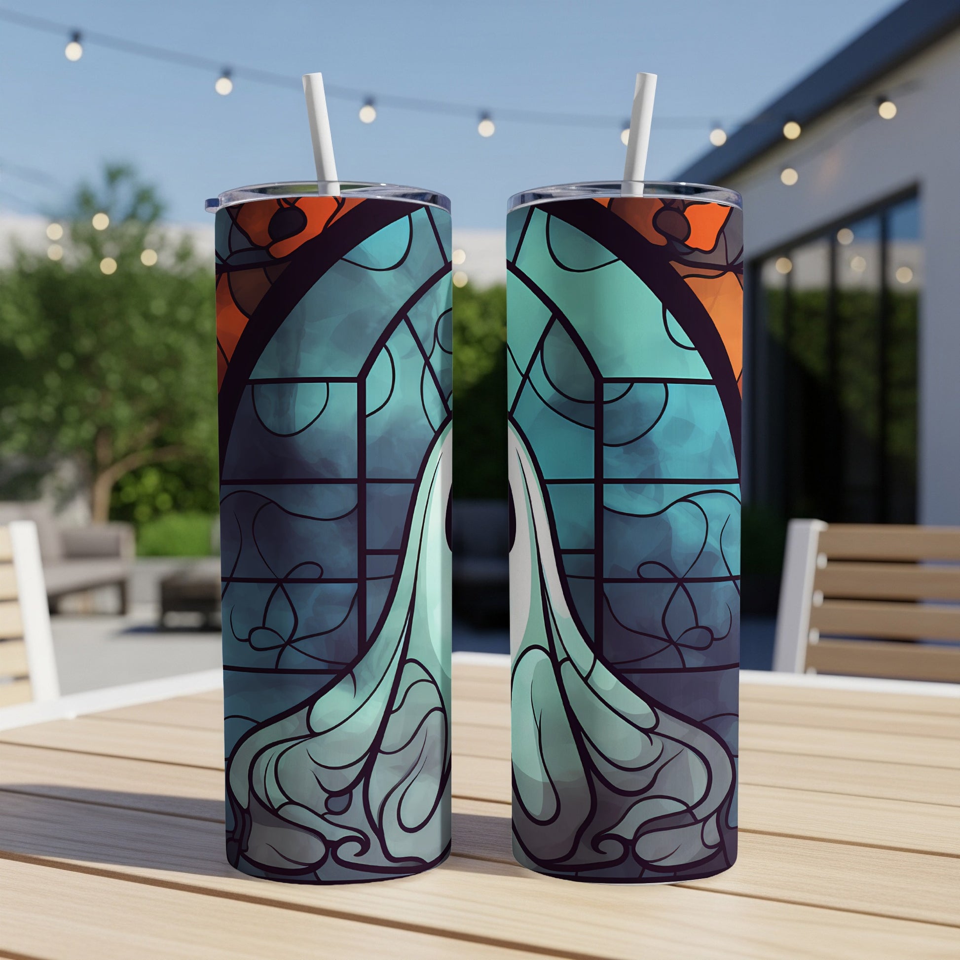 Two stained-glass style tumblers with abstract blue and orange designs.