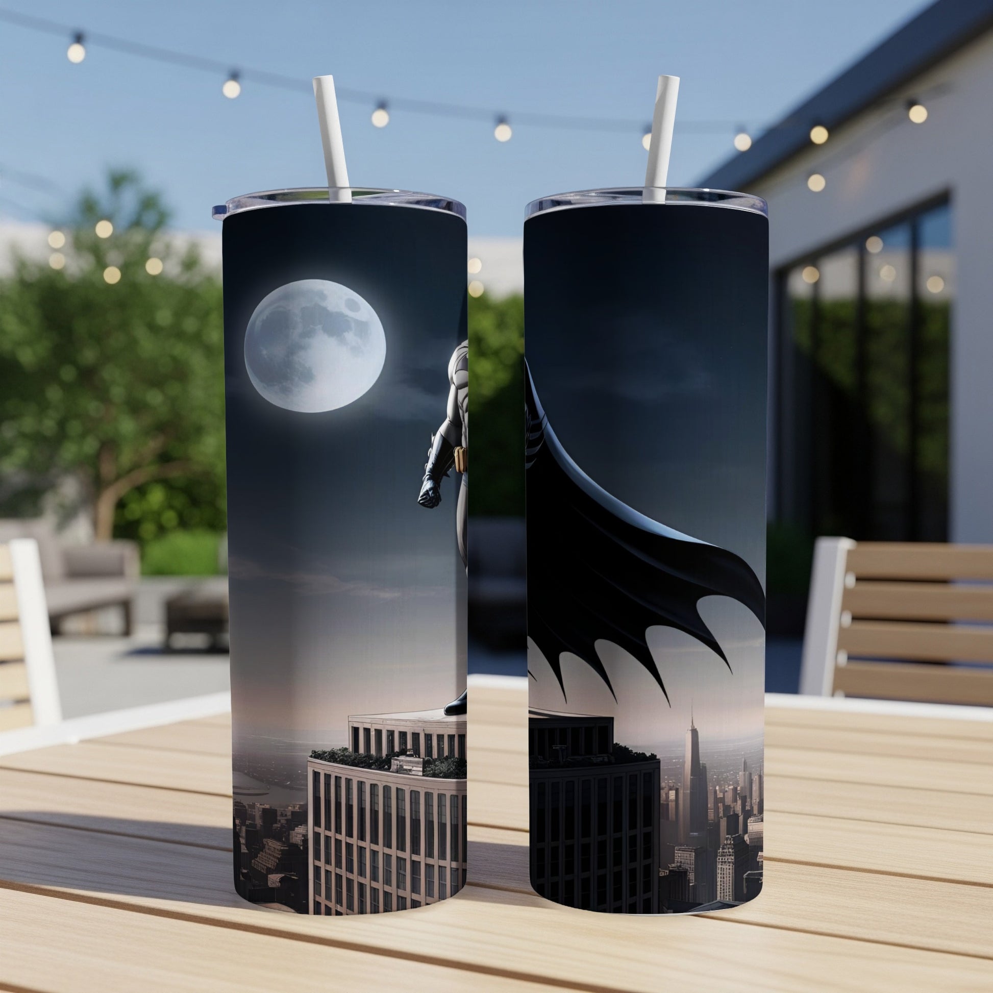 Batman standing on a skyscraper at night with the moon in the background.