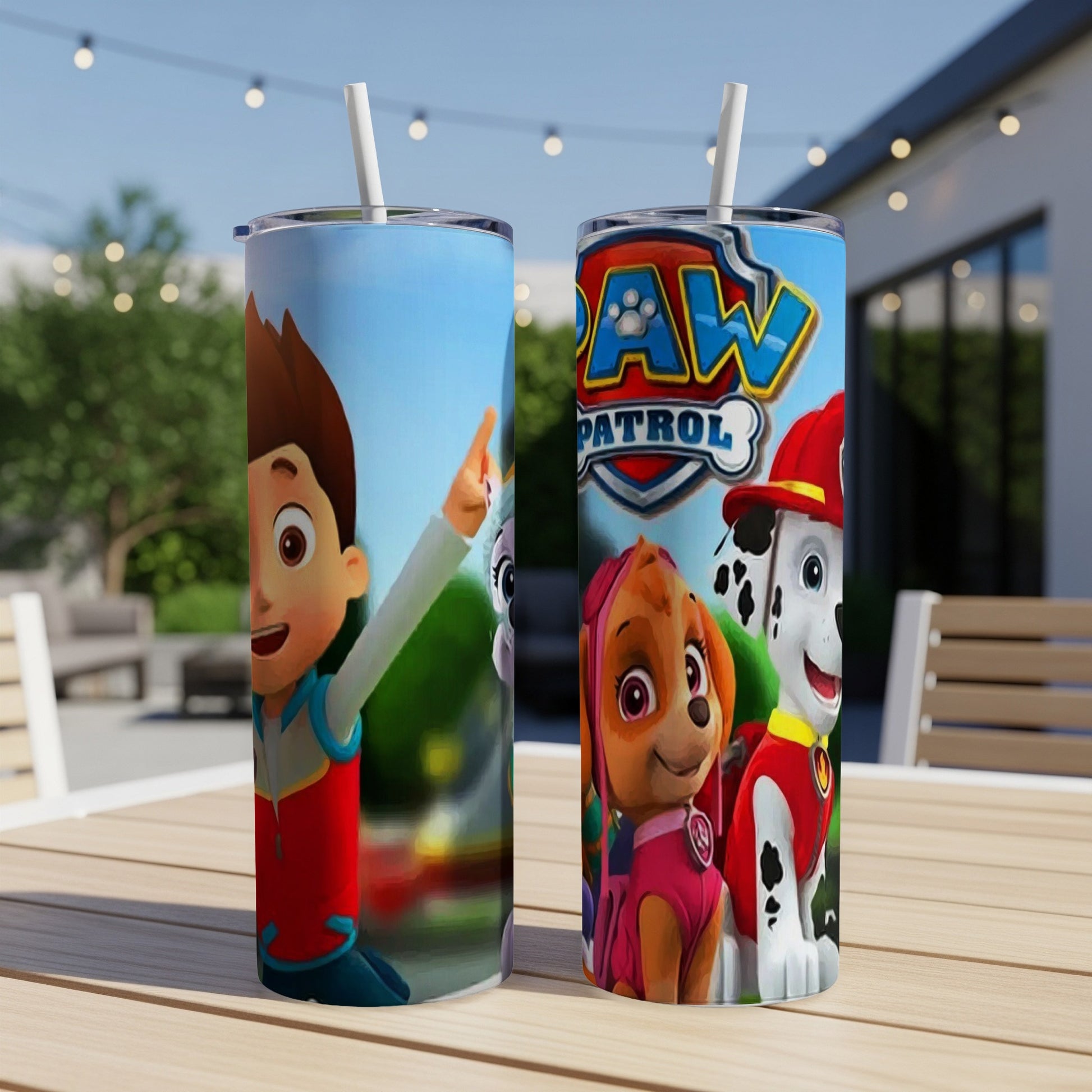 Paw Patrol characters Ryder, Skye, and Chase on a blue tumbler with straws.