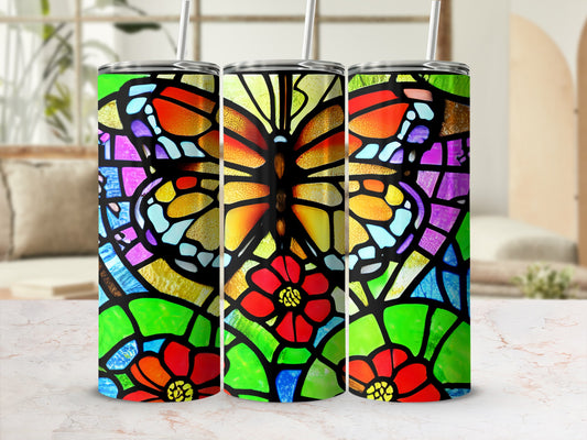Three tumblers with stained-glass butterfly and floral designs.