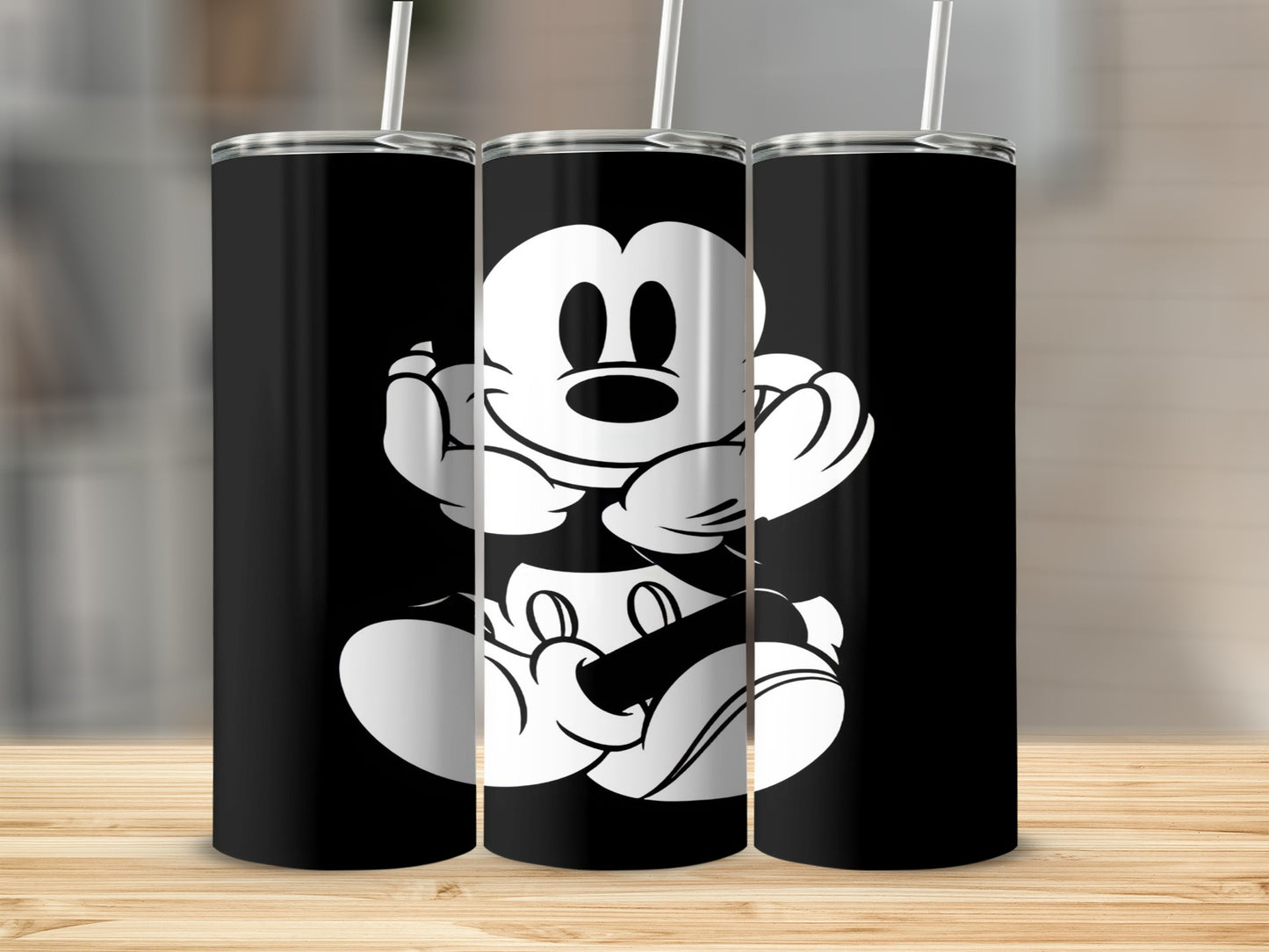 Three black tumblers featuring Mickey Mouse design.