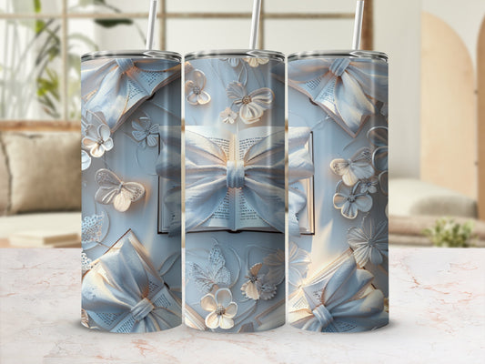 Three tumblers with ornate white bows, butterflies, and floral embellishments.