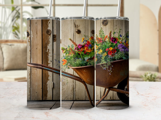 Rustic wheelbarrow overflowing with colorful wildflowers against a weathered wood background.