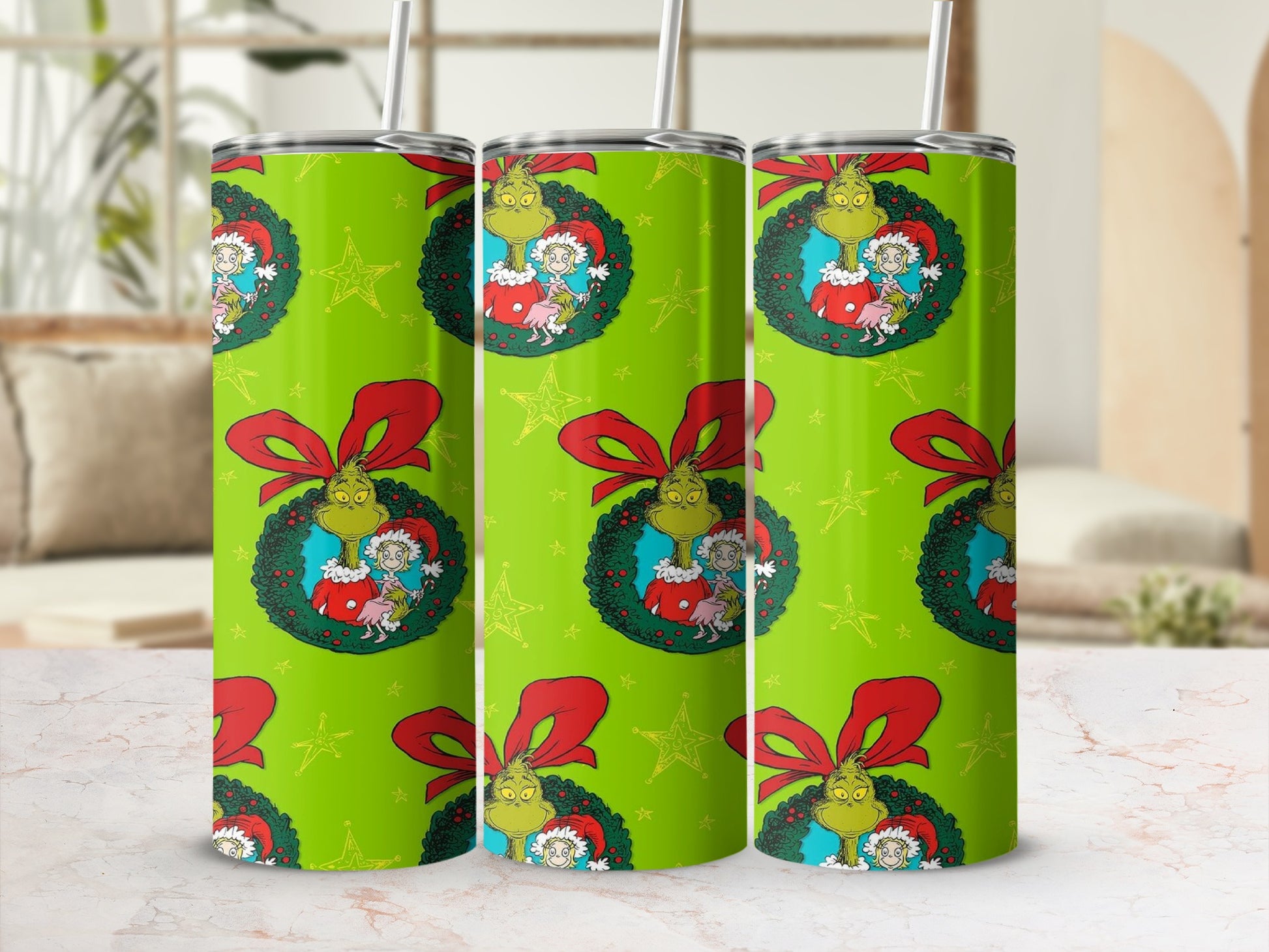 Green tumbler with Grinch and Max characters on a Christmas wreath pattern.
