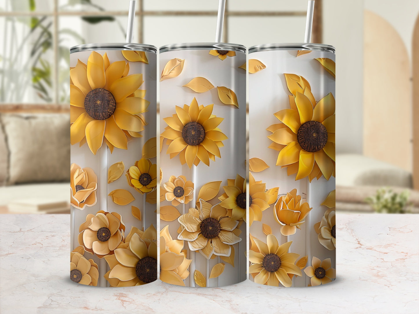 Three stainless steel tumblers with a floral sunflower design.