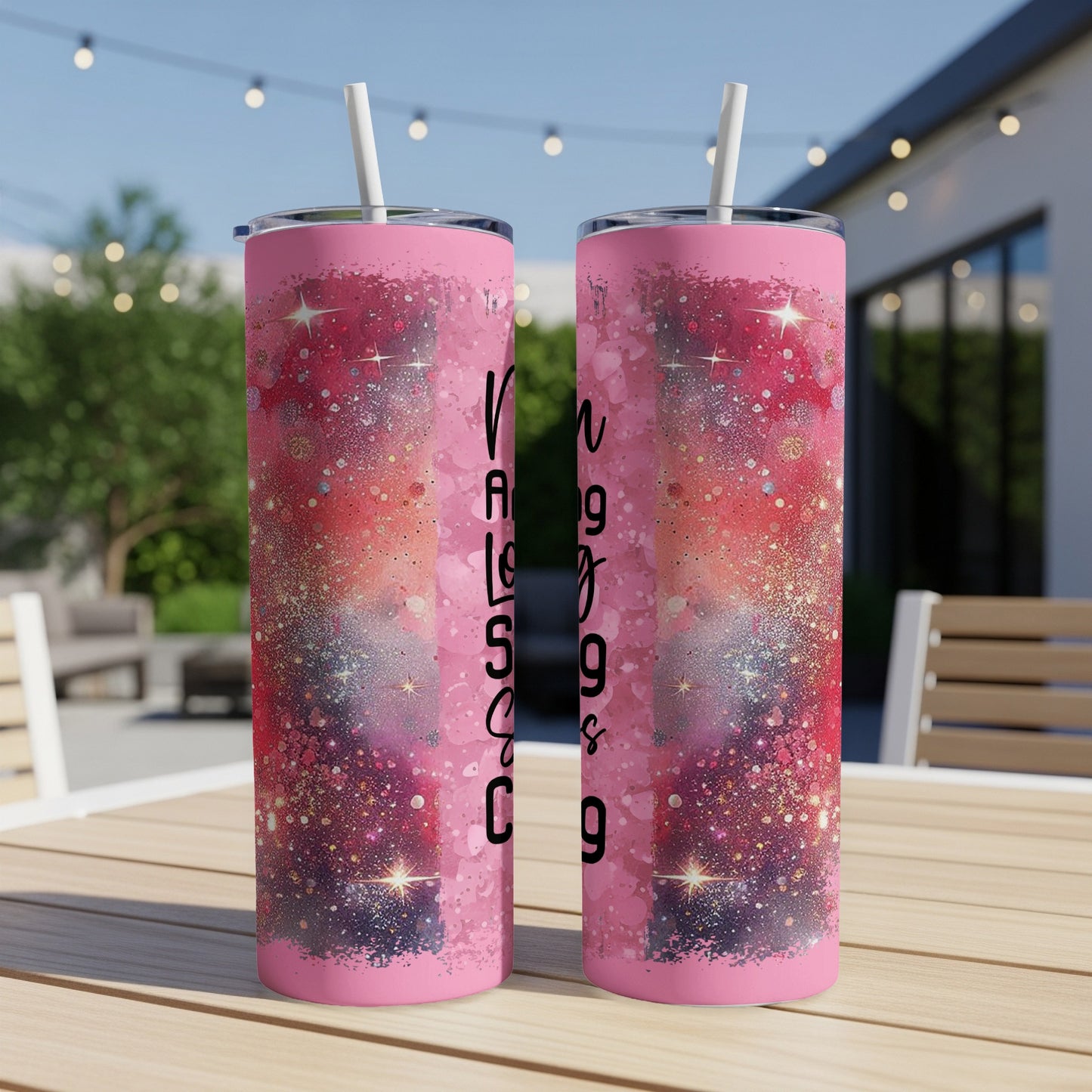 Pink tumbler with colorful glitter design and "Long Legs and a Big Heart" text.