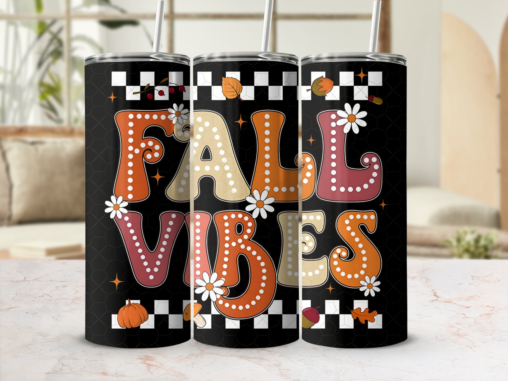 Black tumbler with "FALL VIBES" text, autumn leaves, and pumpkins.