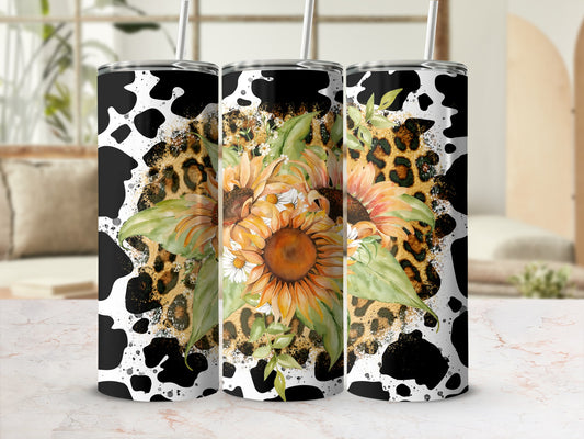 Sunflower and leopard print tumbler with black cow spots.