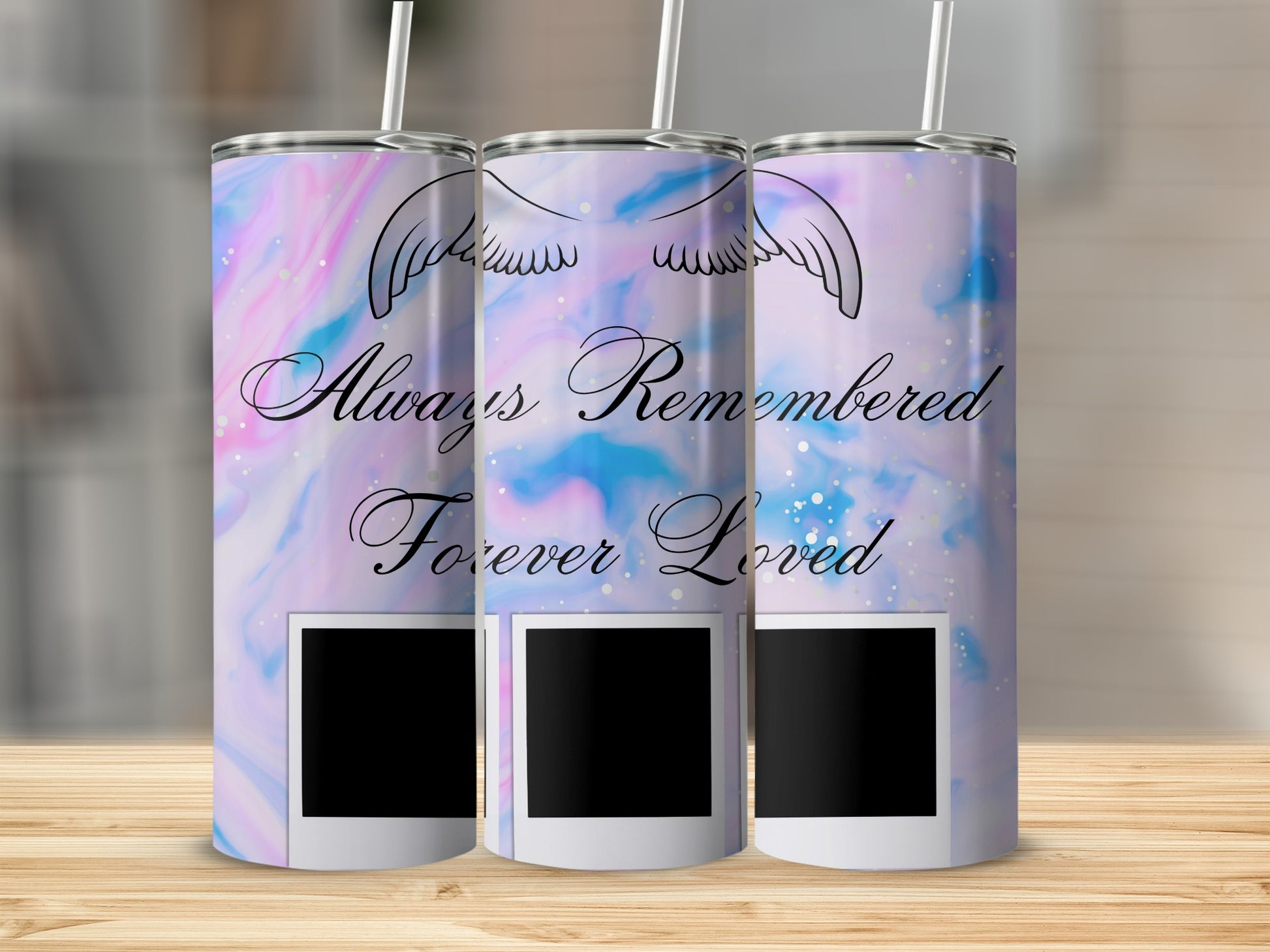Tumblers with angel wings, "Always Remembered Forever Loved" text, and photo frames.
