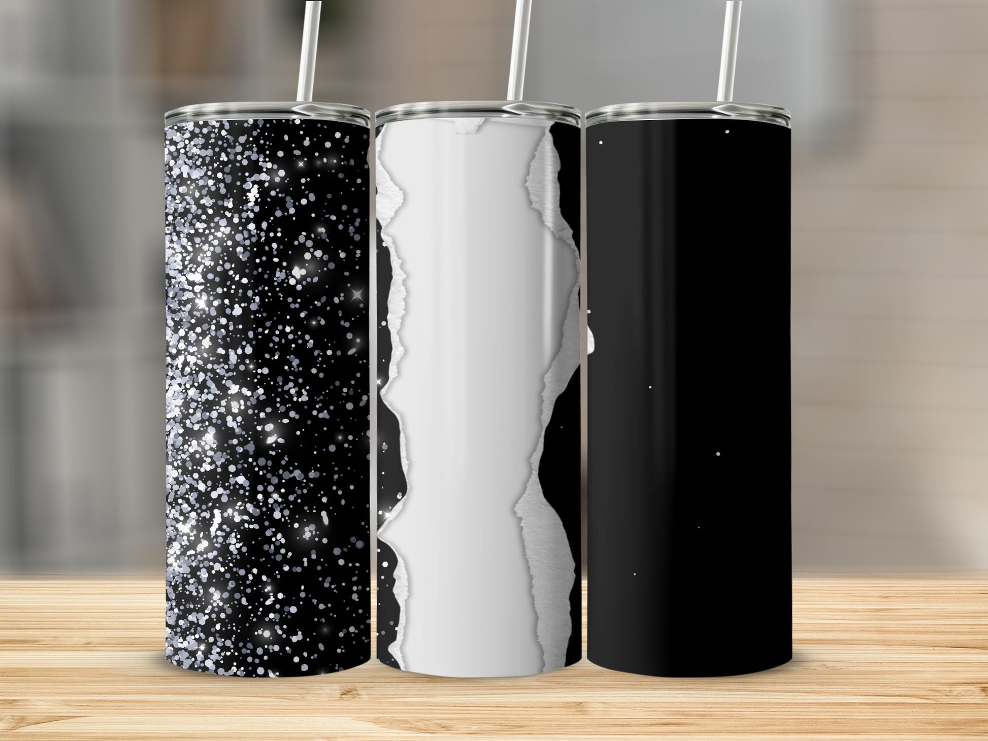 Three tumblers with glitter, ripped paper, and solid black designs.