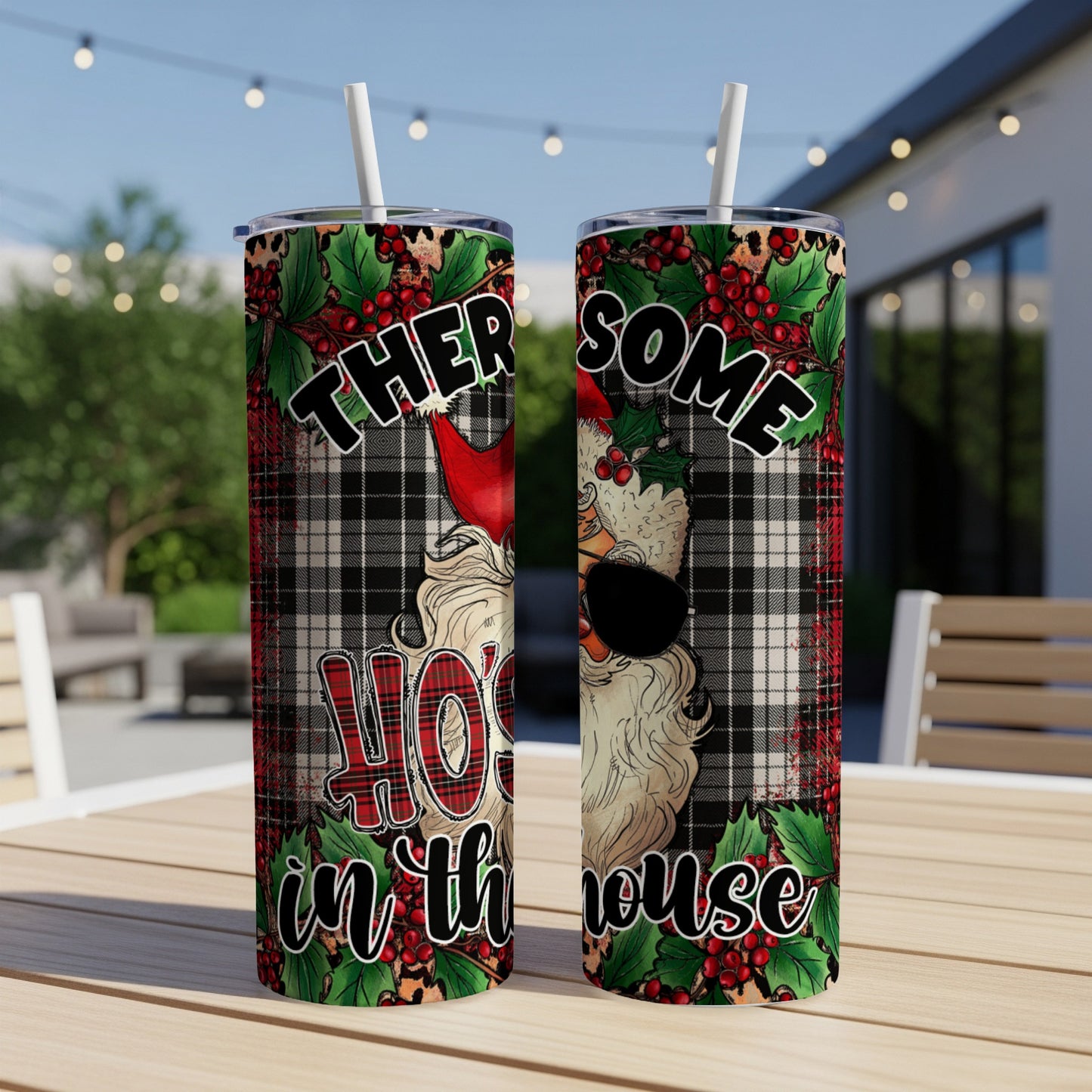 Two Santa tumblers with "Ho Ho Ho in the house" text and plaid design.
