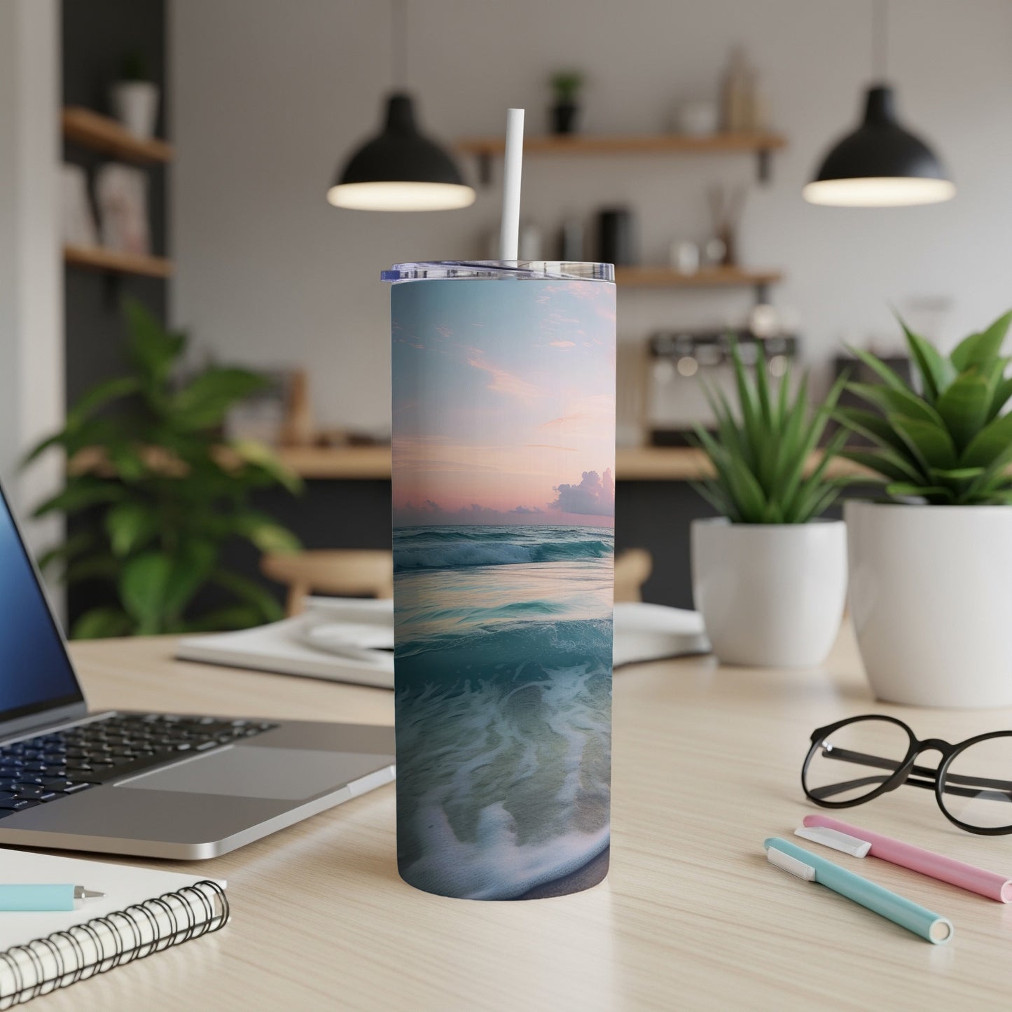 Ocean waves sunset design on a white tumbler with straw.