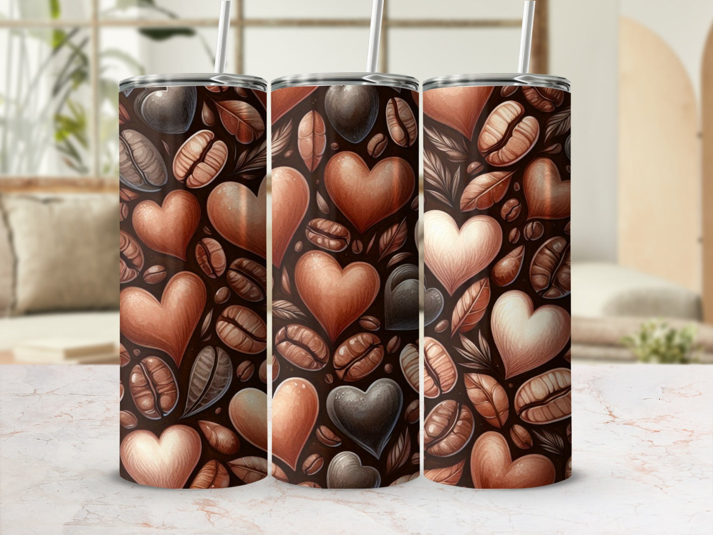 Three tumblers with coffee beans and heart designs.