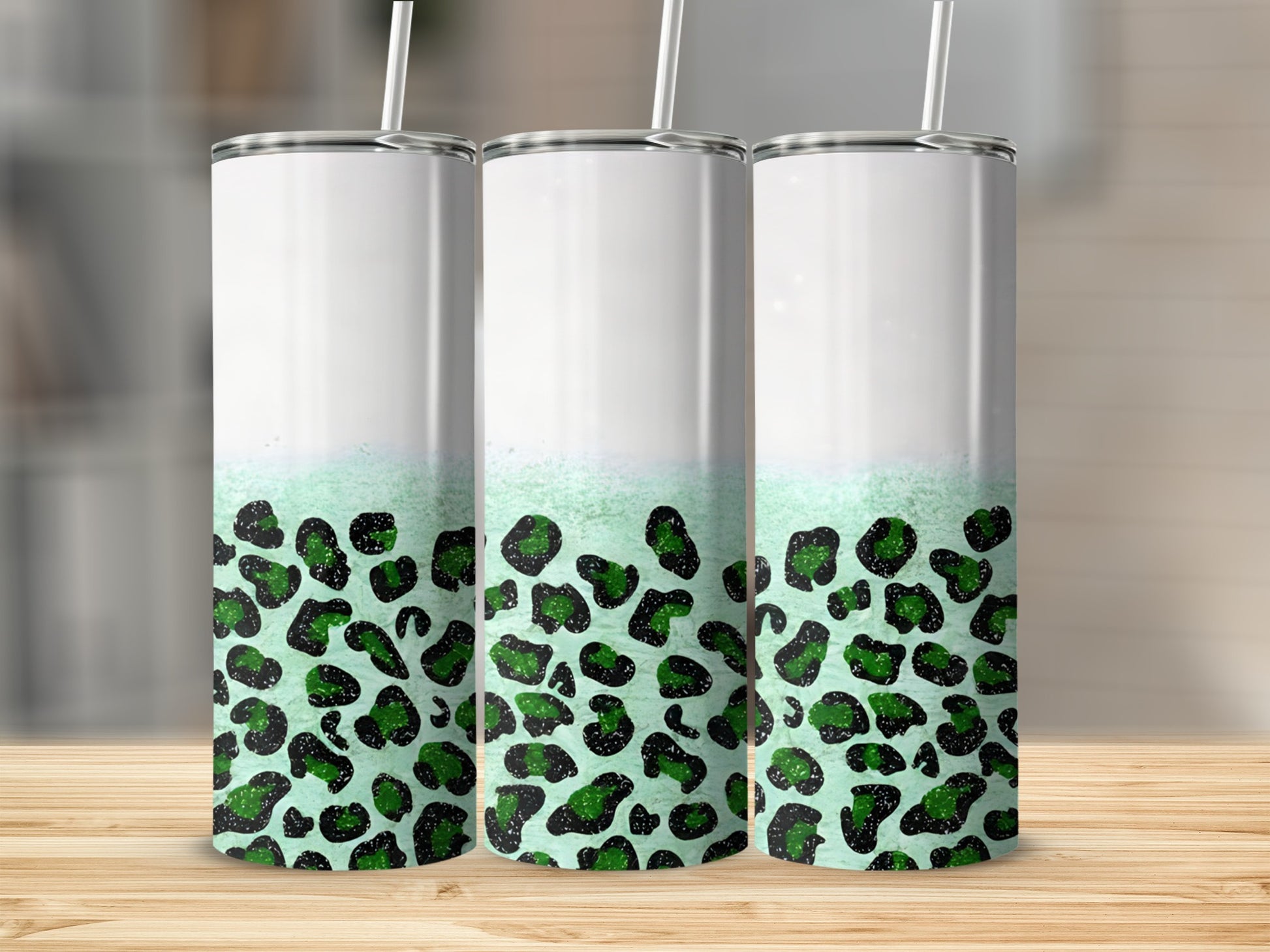 Three blank tumblers with green leopard print design.