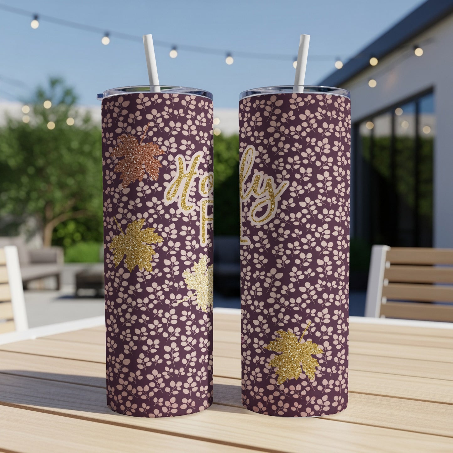 Two purple tumblers with a floral pattern and "Holly Jolly" text.