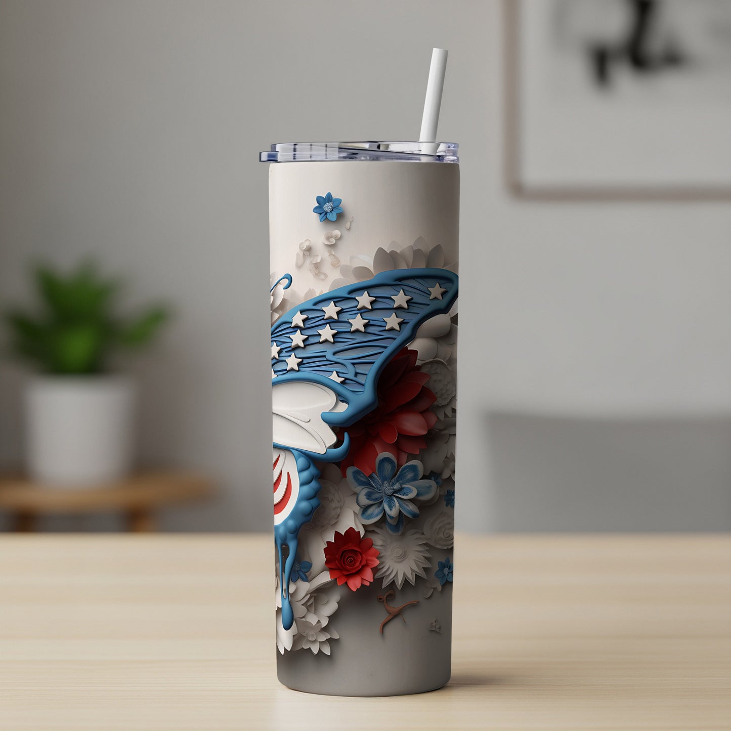 Tall tumbler with butterfly and floral patriotic design, white straw.