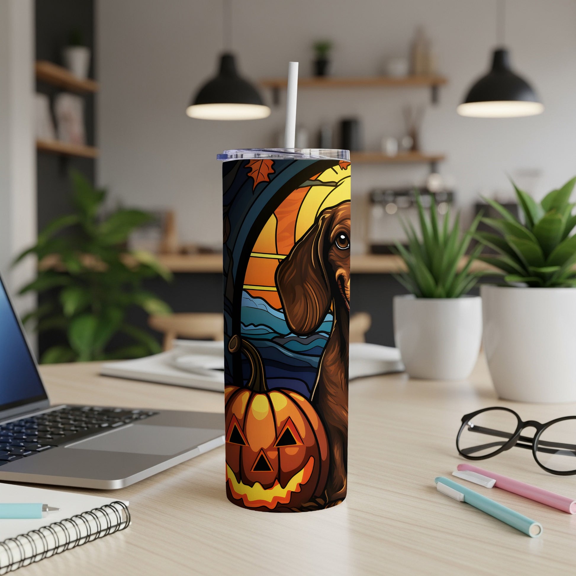 Tumbler with dachshund, jack-o'-lantern, and autumn leaves design.