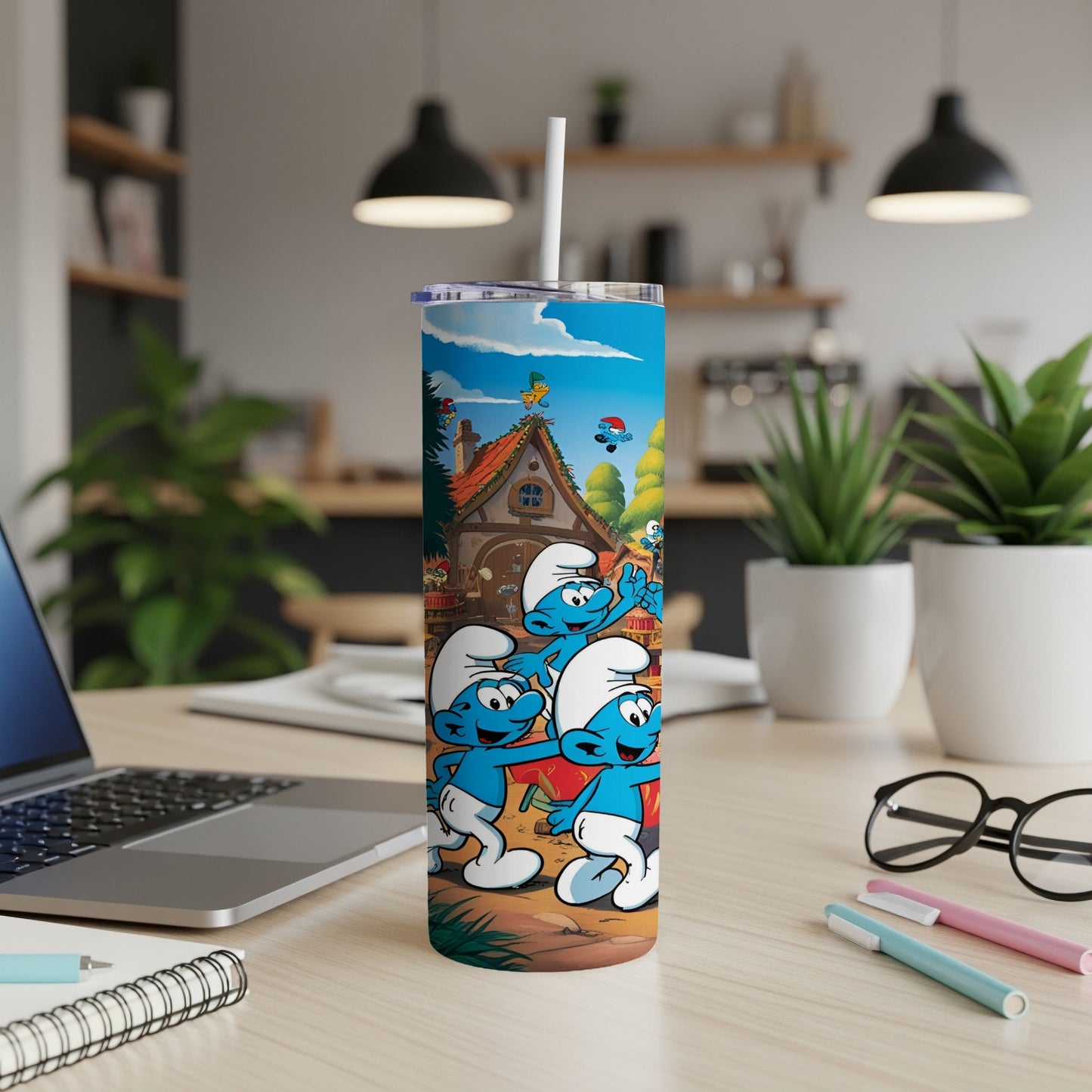 Smurfs characters on a skinny tumbler with a straw, indoors.