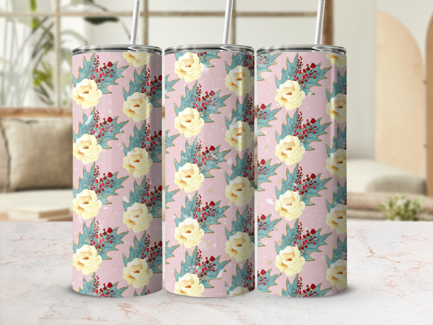 Pink tumbler with a floral and holly berry pattern.