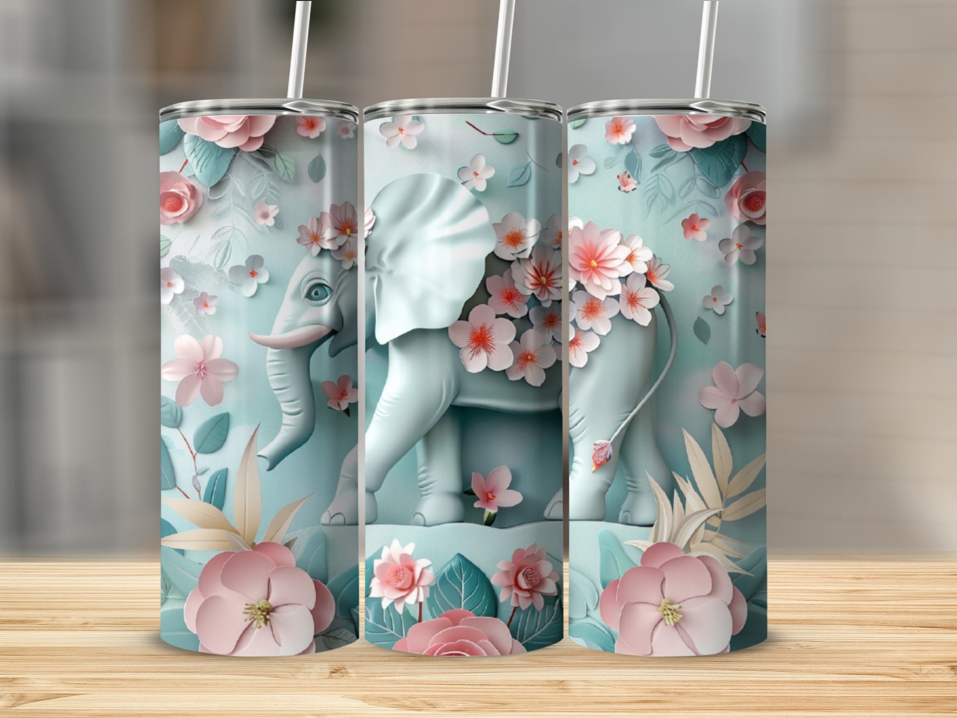 Three tumblers with a pastel elephant and floral design.