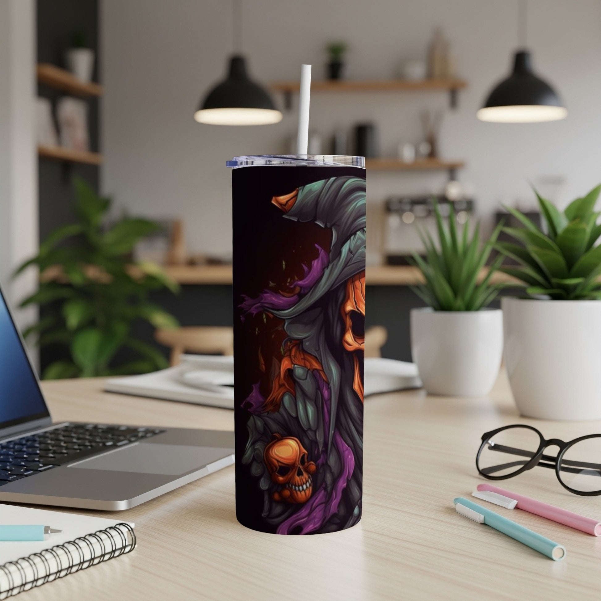 Tumbler with a grim reaper and skull design with purple and orange accents.