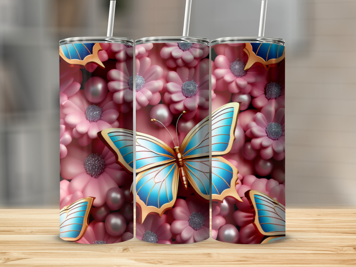 Blue butterfly with pink flowers and pearls design on three tumblers.