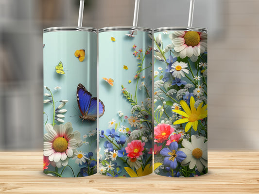 Three tumblers with blue butterflies and colorful wildflowers against a pale blue background.