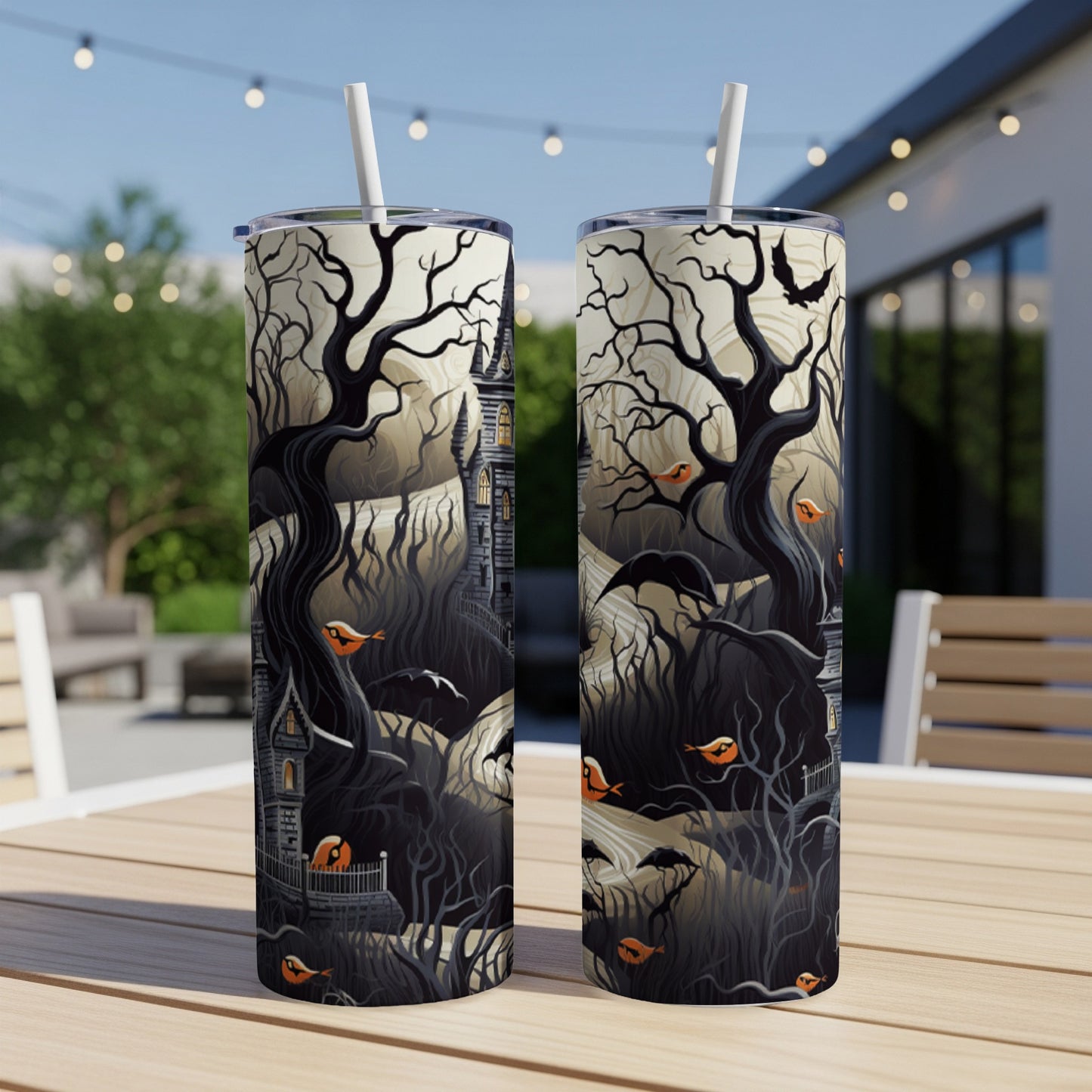 Two tumblers with a haunted forest scene, featuring bare trees, a spooky house, and orange birds.