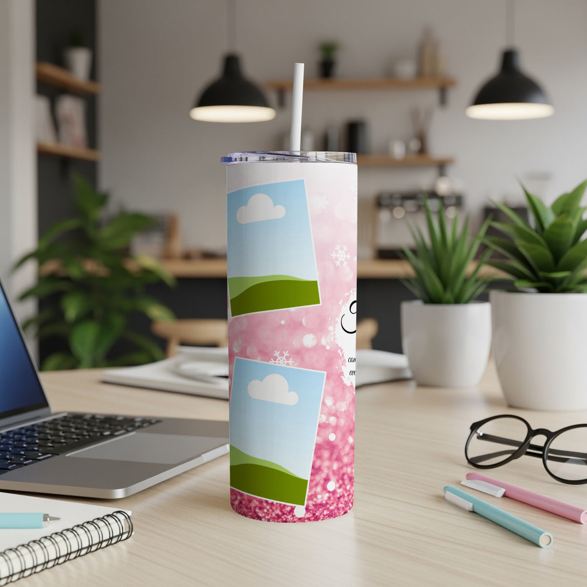 Pink glitter tumbler with photo placeholders and white snowflakes on a desk.
