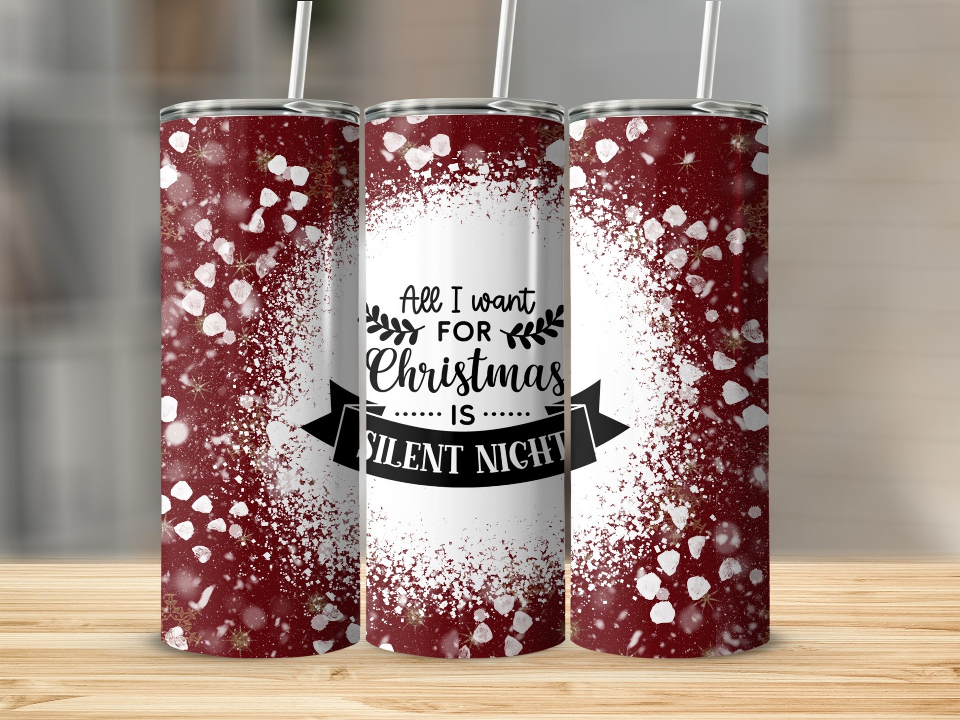 Three maroon tumblers with white snowflake spray and "All I want for Christmas is Silent Night" text.
