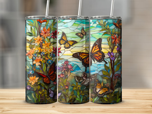 Three tumblers featuring stained glass art with butterflies and flowers.