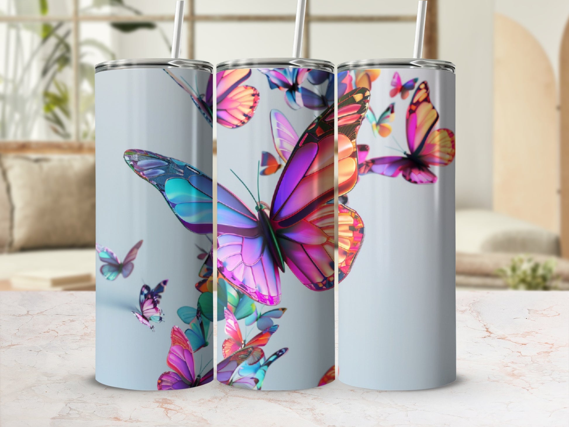 Three tumblers with vibrant, colorful butterflies in flight.