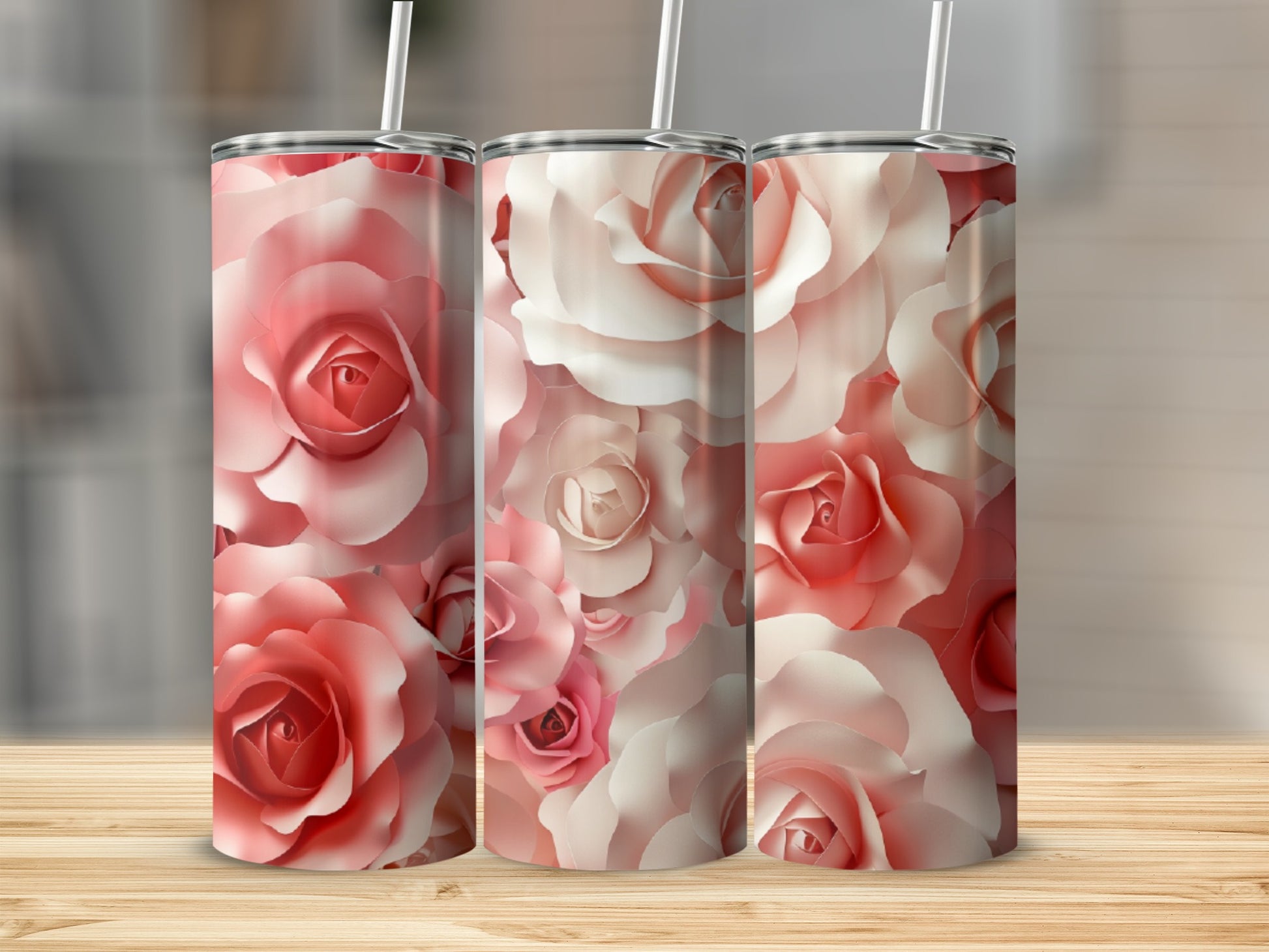 Three tumblers with a pink and white rose floral pattern.