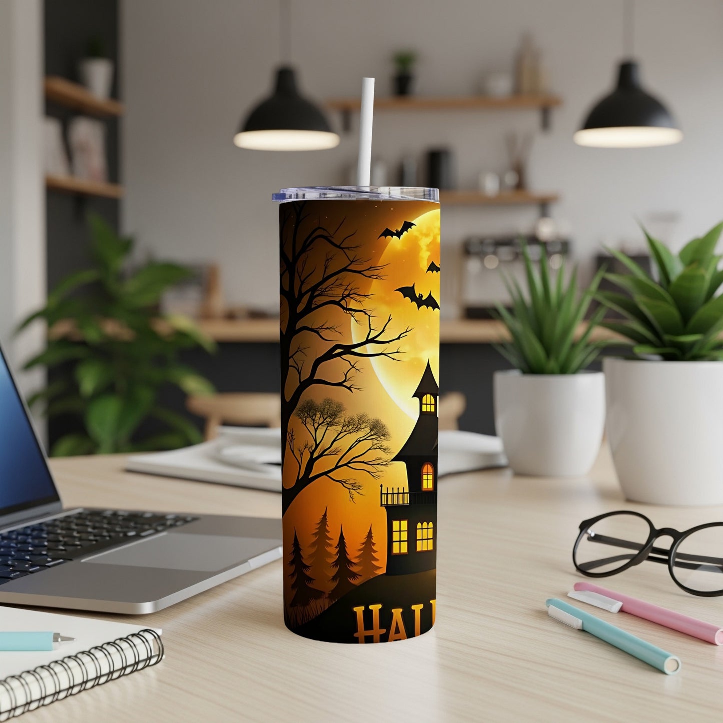 Halloween tumbler with spooky haunted house, bats, full moon, and text "Halloween".