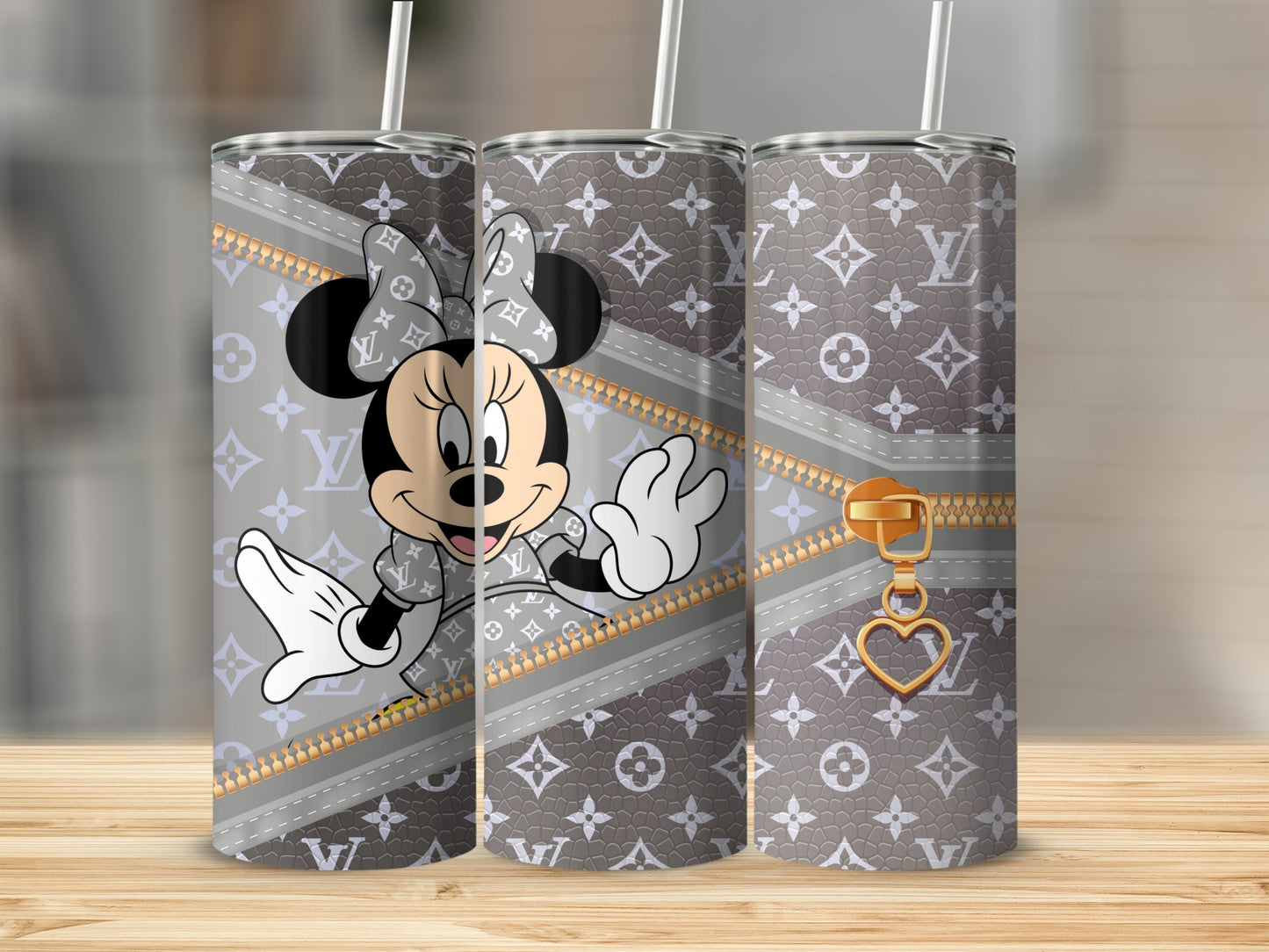 Minnie Mouse on a gray tumbler with LV-style pattern and gold zipper detail.
