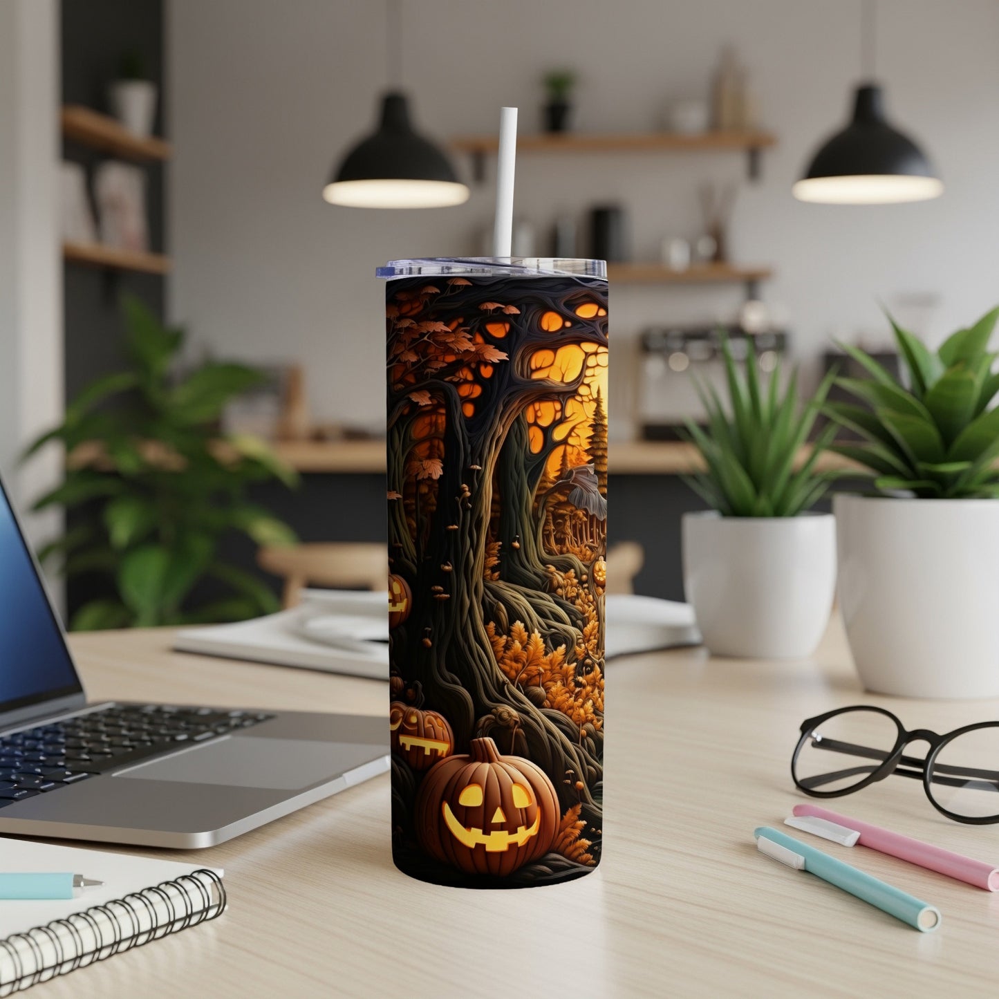 Tumbler with spooky forest and jack-o'-lantern Halloween design.