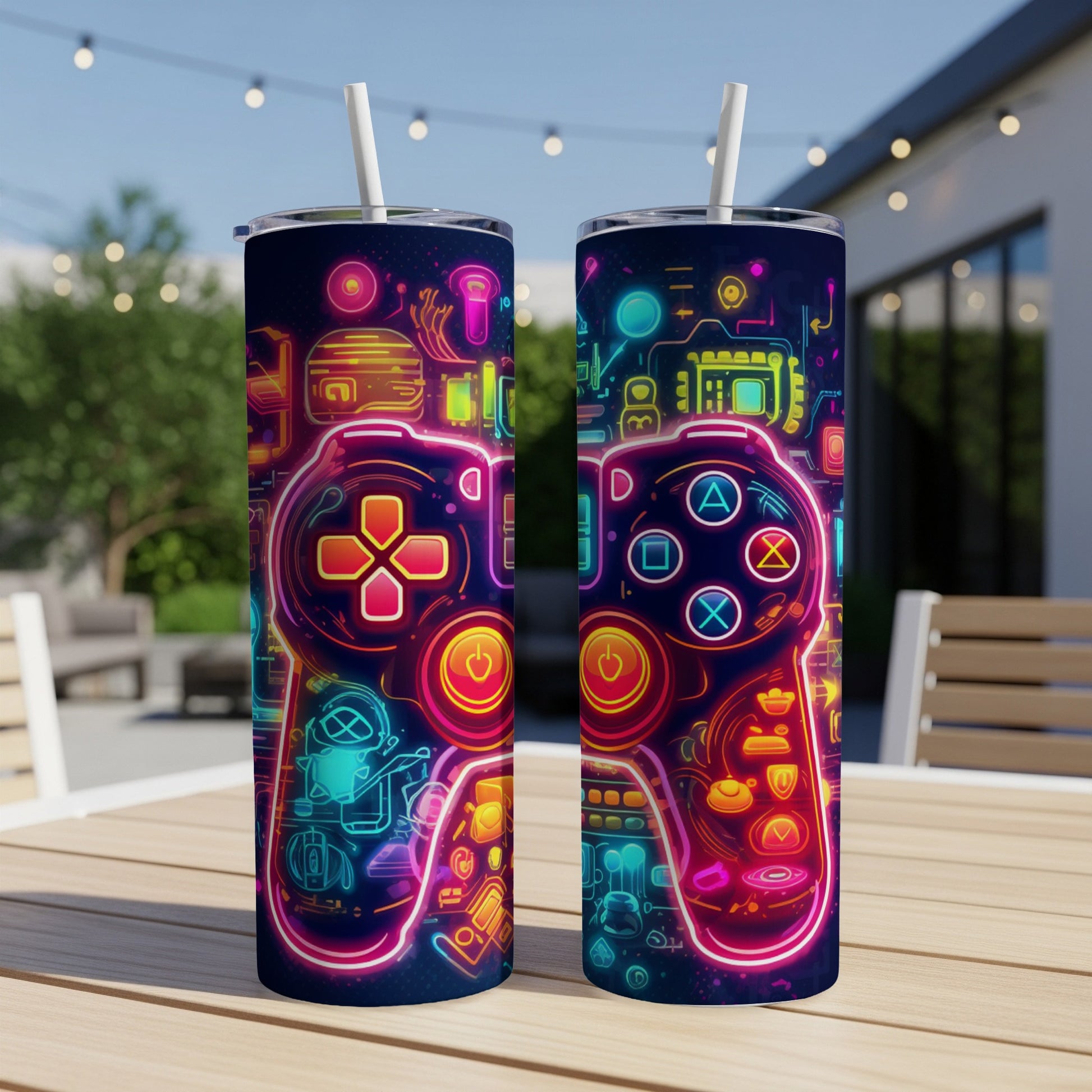 Two tumblers with neon video game controller design on a table.